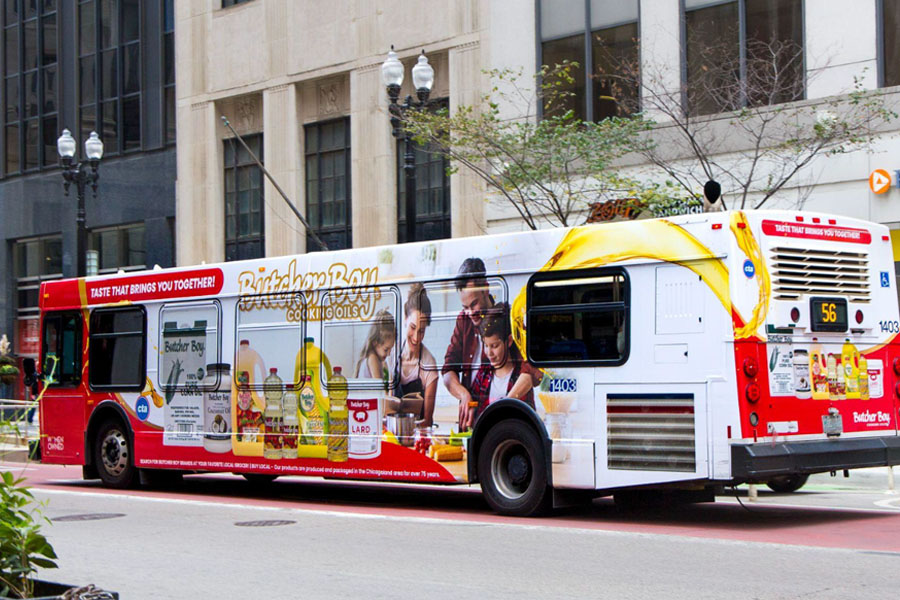 A bus branded with several Butcher boy branded items and a large butcher boy logo.